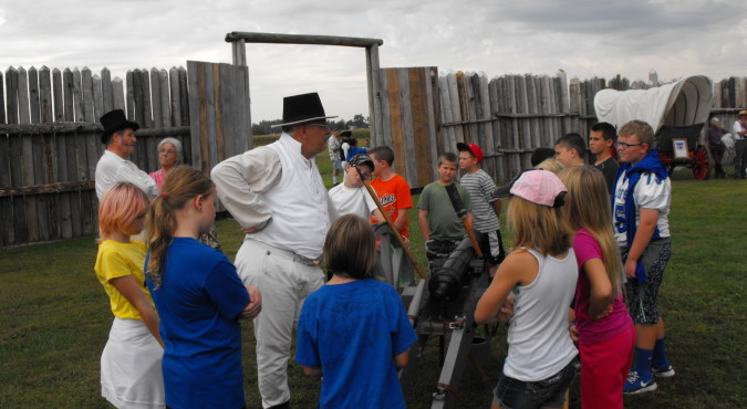 "Vendors and demonstrators interacting with guests."